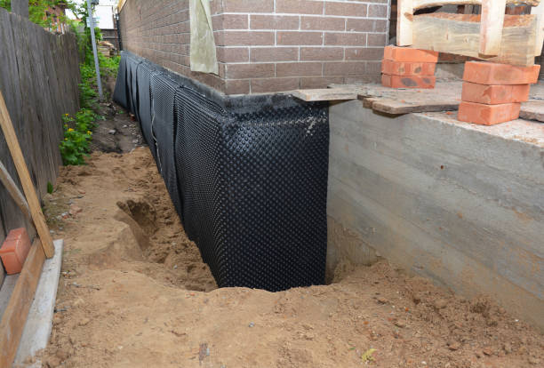 Happy homeowners after waterproofing job in Philo